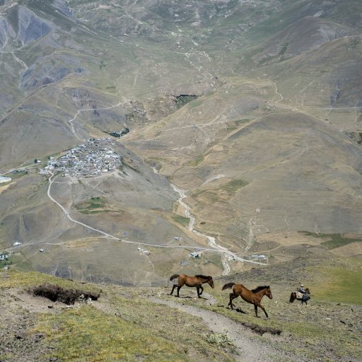 A shepherd rides a horse in the mountains near Khinalug village, Azerbaijan, 2016. Khinalug is the highest, most remote and isolated village in Azerbaijan. ©Oleksandr Rupeta for the VII Mentor Program.