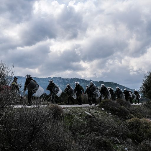 In Mantamados, Greece, on Feb. 26, 2020, villagers confront the Greek police force, known as the MAT, during protests against a proposed migrant detention camp on the island of Lesvos. Demonstrations also took place on the nearby island of Chios over its planned detention center. ©Byron Smith for VII Mentor Program.