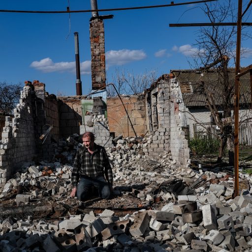 Serhiy, 56, helps his elderly neighbors retrieve tools from the rubble of their home in Chernihiv to rebuild in April 2022. The city, population 285,000, was under siege for 39 days, resulting in 700 deaths, the mayor said. ©Byron Smith for the VII Mentor Program.