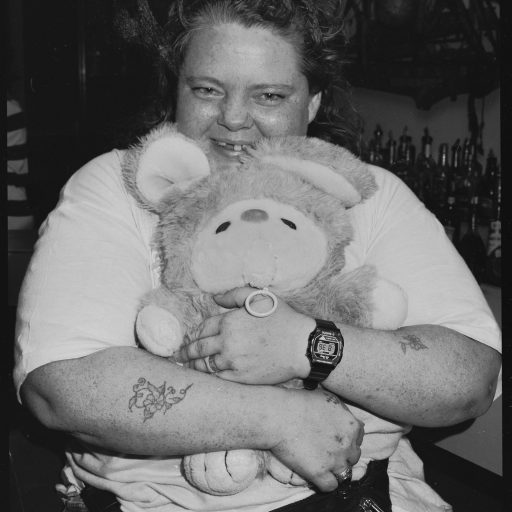 Miami, Florida, South Beach, 1990.
A patron and her talking bunny at Jessie’s Dollhouse Bar on Washington Avenue in Pre-Gentrified South Beach. Jessie’s, like all the other neighborhood bars that thrived from the 1970s to the 1990s, have been closed. © Brenda Ann Kenneally.