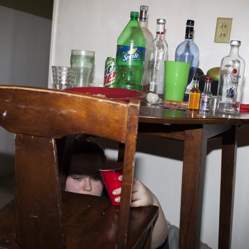 Troy, New York, 2014.
An ex-girlfriend of Kayla’s younger brother drowns her sorrow in alcohol during a party at Kayla’s apartment. Love is a powerful place to go when economics prohibit other recreation and escapes, and the weight means break-ups are particularly devastating. © Brenda Ann Kenneally.