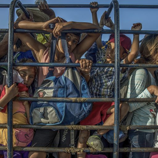 Pijijiapan, Chiapas, Mexico, October 25, 2018. Members of the migrant caravan that left Honduras in mid-October pile up in the back of a truck as they leave the town of Pijijiapan, in the southern Mexican state of Chiapas, towards their next stop.©Adriana Zehbrauskas.