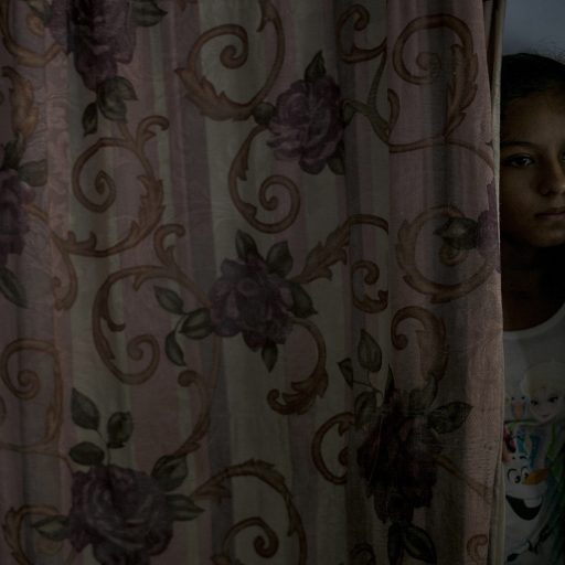 El Progreso, Honduras, July 1st, 2016. Gabriela, aged 13, is at home in El Progreso, Honduras, with her father, Pedro, and siblings Angel Gabriel, 12, Kaily, 7, and Valeria, 4. They were kidnapped by the Zetas in Mexico while attempting to reach their mother in the United States. The family was held hostage for 42 days and was released after their mother paid the ransom with all the money she had saved for their relocation.

In 2016, I traveled to Honduras with UNICEF to work on a report about refugee and migrant children. The report focuses on the reasons they leave home, the dangers encountered on their journey, and the challenges they face while seeking refuge in the United States. ©Adriana Zehbrauskas for UNICEF.