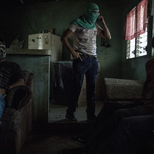 San Pedro Sula, Honduras, June 8th, 2017. Members of a local street gang congregate inside their safehouse in an impoverished neighborhood of San Pedro Sula. As adversaries of the two main gangs, the Mara Salvatrucha (MS-13) and Barrio 18, their primary activities include protecting their neighborhood, engaging in small-scale drug trafficking (narcomenudeo), and working as hitmen.

Gang violence, poverty, and inadequate political and socio-economic conditions continue to drive a significant number of Hondurans to seek asylum in the United States, as well as in other countries across Latin America and Europe. ©Adriana Zehbrauskas.