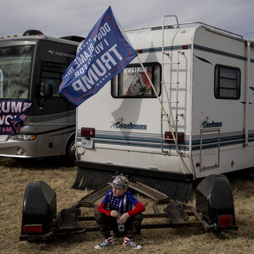 Florence, Arizona, Brooke, 5, waits for his grandmother and takes a rest from the long lines to enter Donald Trump’s rally at Canyon Moon Ranch, in Florence, AZ on Jan 15th, 2021. © Adriana Zehbrauskas.