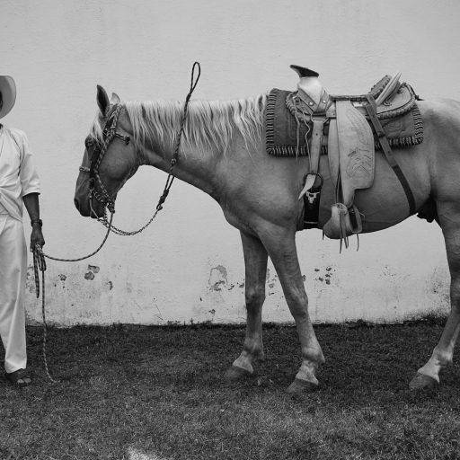 Huehuetonoc, Guerrero, Mexico, Dec 2015: Don Gerardo and his horse El Guero. He asked me if he could bring his horse to be photographed with him: “I want my grandson to know what a good friend I had.” Family Matters Series. © Adriana Zehbrauskas.