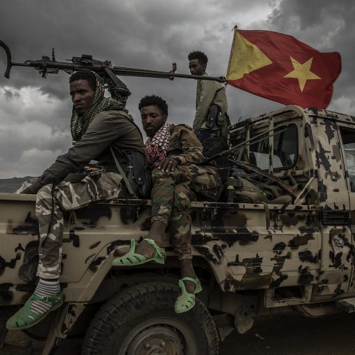 Fighters from the Tigray Defence Forces rest aboard a pick-up truck outside the regional capital Mekelle in Ethiopia's northern Tigray region , on June 29, 2021.  © Finbarr O’Reilly.