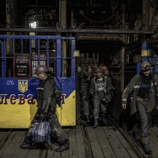 Miners exit an elevator shaft at the end of a 6-hour shift at 1/3 Novogrodivska state-run coal mine, near the town of Selidove, in Ukraine’s eastern Donetsk region, June 8, 2022. © Finbarr O’Reilly.