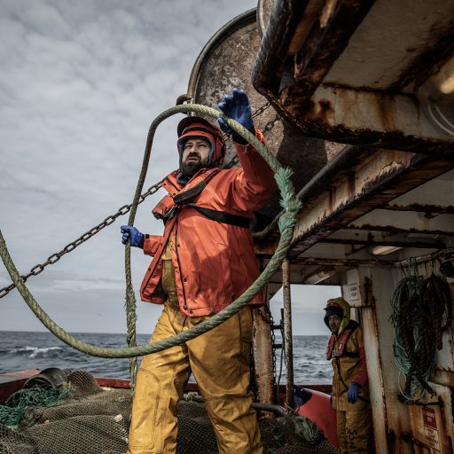 Crew member Mohammed Ghitany, 38, aboard the fishing vessel Aquila on its final voyage, April 4, 2023. The Aquila is being scrapped as part of Ireland’s controversial government decommissioning scheme to reduce by about 30% the number of Irish fishing boats operating in local waters.  Already hammered by overfishing, the increased price of fuel and energy, inflation, geopolitics, and climate change—the Irish fishing industry is now at risk of collapse due to changes in trade rules triggered by Brexit—potentially wiping out entire coastal communities, traditional ways of life, and a pillar of the country’s culture and local economies. Indigenous Irish fishermen openly talk about being “the last generation to fish our seas.” © Finbarr O’Reilly.