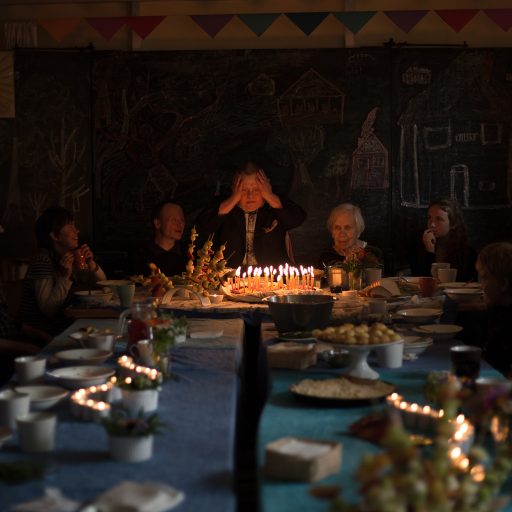 Minya's birthday. He is 50, and he regularly writes letters where he imagines himself as the deputy director of the village. The villagers of Svetlana resemble one big family. They all came to celebrate his birthday. ©Mary Gelman.