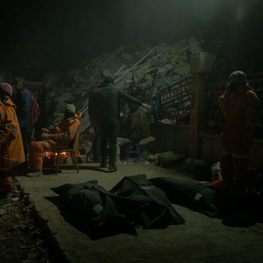 The bodies of three people recovered from the rubble are seen near a site where rescuers continued searching for people, in Antakya, Turkey, on Tuesday, February 14, 2023. 

More than 40,000 people have died and an estimated 200,000 people have been evacuated to nearby provinces, according to official numbers, following two major earthquakes last week in Turkey’s south and south east. © Nicole Tung.