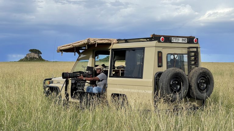 Erica Rugabandana on location in the Serengeti National Park, Tanzania 2023. © Cyril Barbançon for Nature Through Her Eyes.