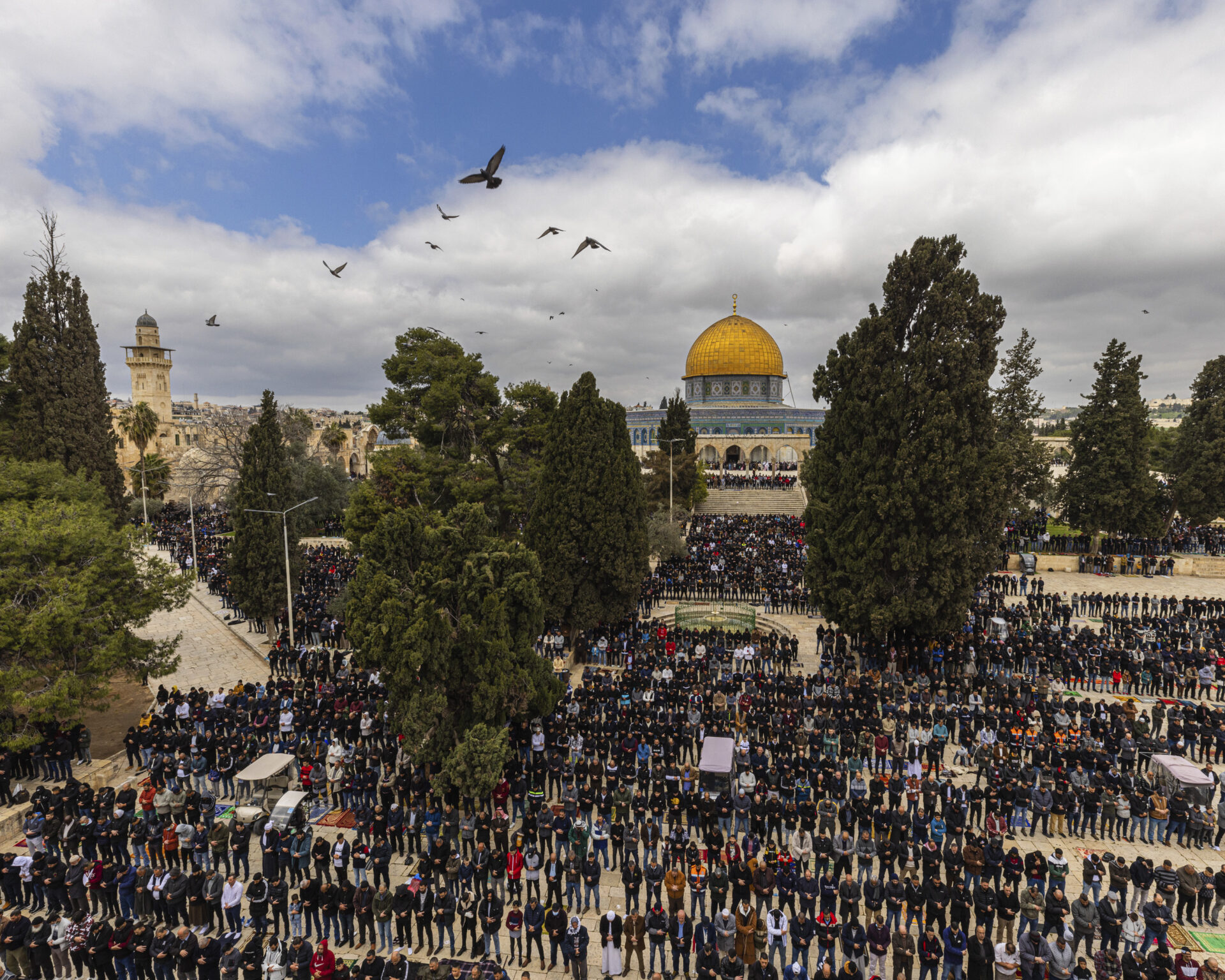 Muslims pray in front of the Dome of the Rock shrine at the Al Aqsa Mosque compound in Jerusalem's Old City. © Ziyah Gafic / VII.