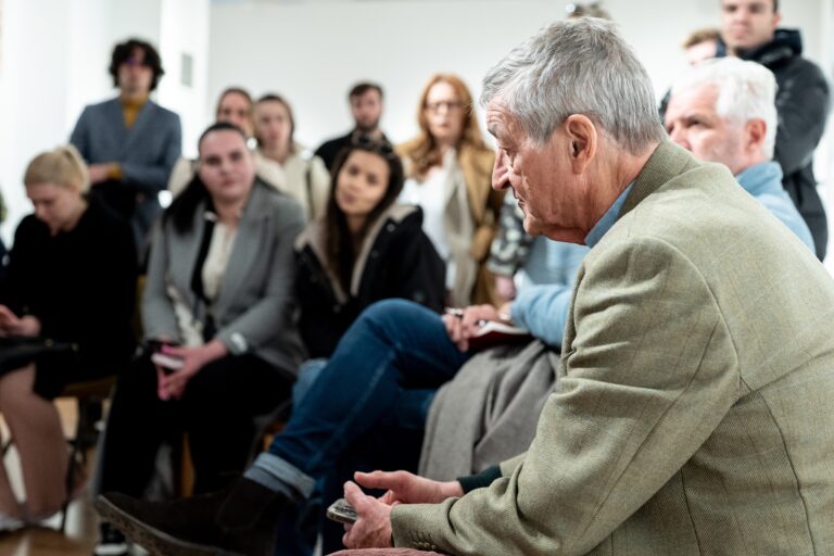 Students from the Faculty of Political Science at the University of Sarajevo engage in a discussion with journalists Gary Knight and Jon Swain during the opening exhibition of “April 1975, Saigon — Phnom Penh” at the National Museum of Bosnia and Herzegovina. © Melanie Sapina for The VII Foundation.