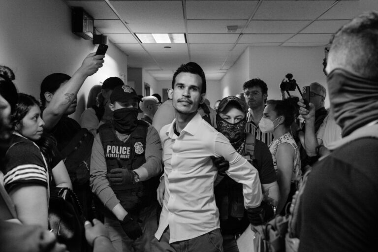 ICE agents detain a man in the hallway of 26 Federal Plaza immediately after his hearing. Arrests like this occur even when respondents comply with court proceedings, a practice immigrant rights groups call “courthouse arrests.” While some families walk out together, others vanish into detention, often transferred to Hudson County Correctional Facility in New Jersey or Orange County Jail in New York. In FY 2025, ICE reported holding over 59,000 people in detention on a given day, nearly half with no criminal record. In New York City, more than 30% of ICE arrests between May and June 2025 occurred inside courthouses. © Nicolò Filippo Rosso.