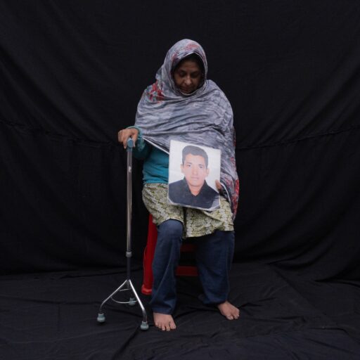 Hasina Banu, 55, the mother of Selim Reza Pintu, who was abducted on Dec. 12, 2013, speaks about the unshakable hope she holds for her son’s return. “Remembering him I stay awake, even when I am asleep. I constantly wait to hear him calling me ‘Maa,’ saying, ‘I have returned.’”
She adds, “I never doubt if my son is alive or dead. I think he is alive. I believe that by the grace of Allah, my son is alive. He is still alive and will return. I read the Quran and talk to my Allah, and my prayers are always with him.” Photographed in Dhaka on Dec. 25, 2023. © Mosfiqur Rahman Johan.
