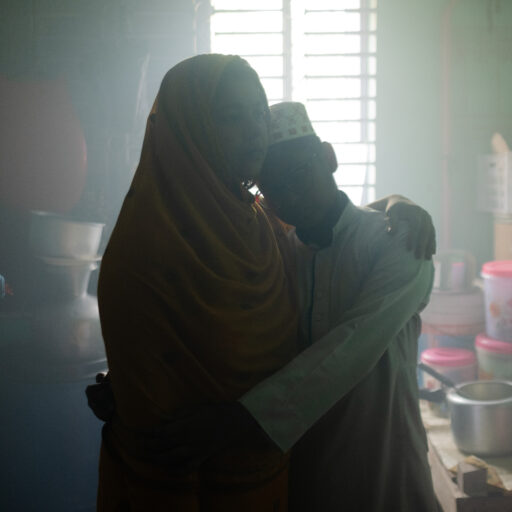 Wife to a disappeared individual (Firoz Khan), A single mother fights against financial crisis and mental trauma to ensure basic education for her child, living in a congested, dark room. Firoz Khan was abducted in 2012. The photograph was taken in Pirojpur, on September 15, 2022. © Mosfiqur Rahman Johan.