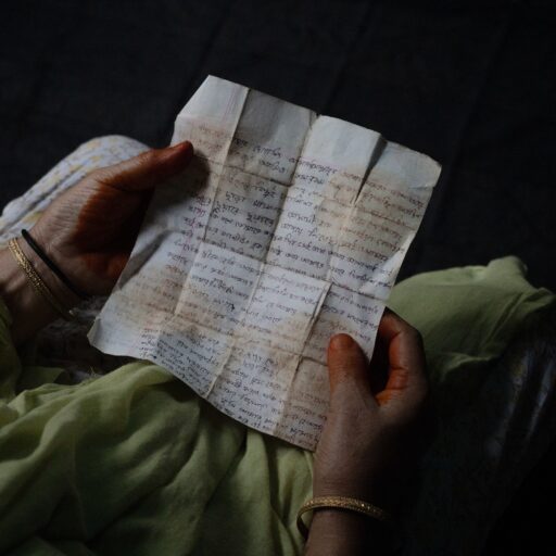The preserved letter of Mohammad Chowdhury Alam, written to his wife from jail in 1992 after he was arrested in political cases, is seen in this photograph taken on June 5, 2025. Alam was forcibly taken on the evening of June 25, 2010, when several men in plain clothes pulled him into a white microbus in Dhaka; he has remained missing since. The letter is kept by his family as one of the last personal traces of his life and memory. © Mosfiqur Rahman Johan.