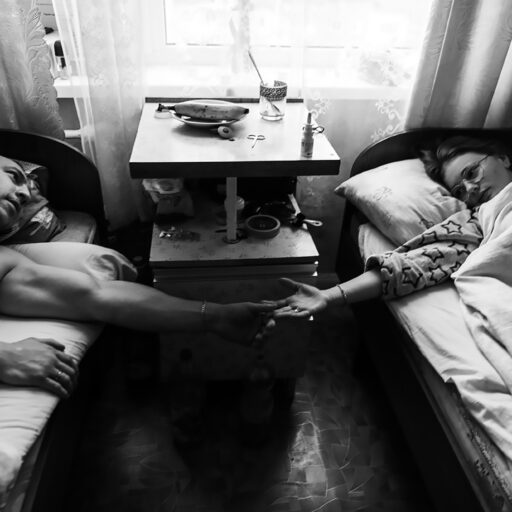 Ira, 19, supports her boyfriend, Mischa, in the hospital after he lost both his legs defending Ukraine, 2022. © Svet Jacqueline.