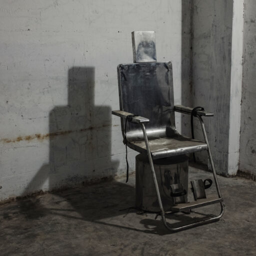A spinning chair, initially misidentified as an electric shock device, allegedly used by security forces under former Prime Minister Sheikh Hasina to torture victims of enforced disappearance in secret detention sites known as “Aynaghar.”The photograph was taken at a Rapid Action Battalion (RAB-2) facility described as a secret detention centre.Bangladesh — March 15, 2025. © Mosfiqur Rahman Johan.