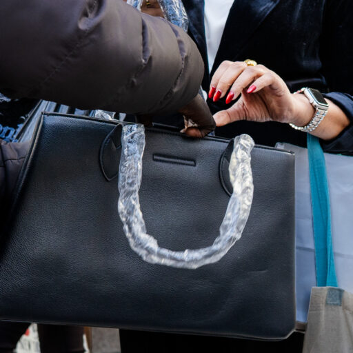 Canal Street, Manhattan — Senegalese street vendors sell counterfeit brand-name bags to passersby on Canal Street in Manhattan on Friday, October 24, 2025. New Yorkers and travelers, especially on weekends, visit the area to shop for counterfeit designer goods, a market whose popularity also circulates on social media. © Arisa Haboshi.