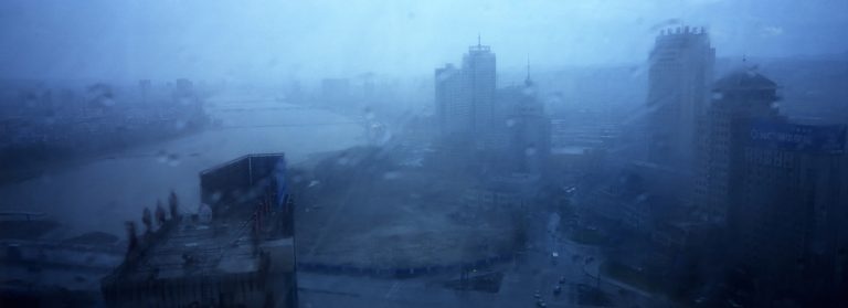 Buildings are seen through a storm in Yanji, China. The city of Yanji is a major hub for North Korean escapees and defectors.