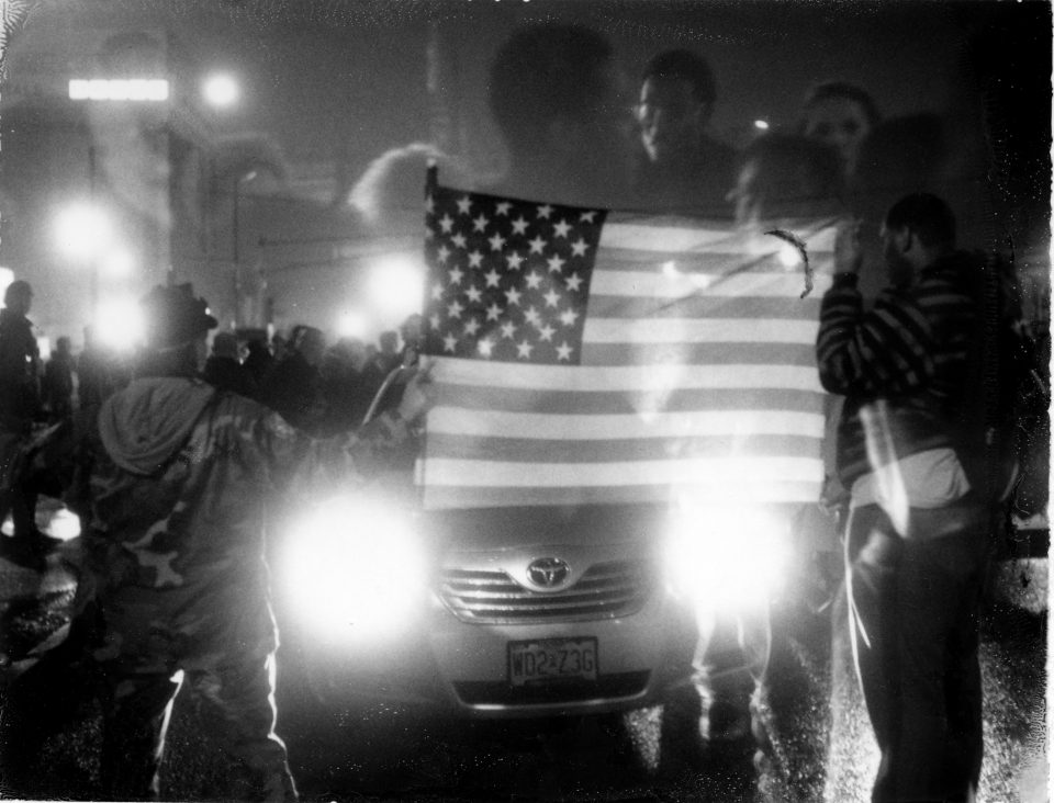 Demonstrators block the streets in St. Louis to protest the killing of Michael Brown, 24 hours before a grand jury decided that police officer Darren Wilson would not face charges in the shooting of Michael Brown. Rioting and looting broke out soon after the announcement throughout the area leaving several businesses burned to the ground.